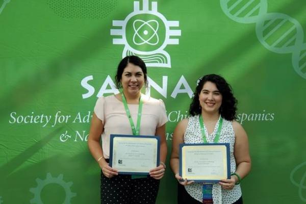 Picture of Ally Langley (left) after receiving her SACNAS Conference presentation award. Ally is pictured with fellow presentation award winner Regina Trevino (right), a Chemistry PhD student in the lab of MBTP Trainer, Dr. Hannah Shafaat.
